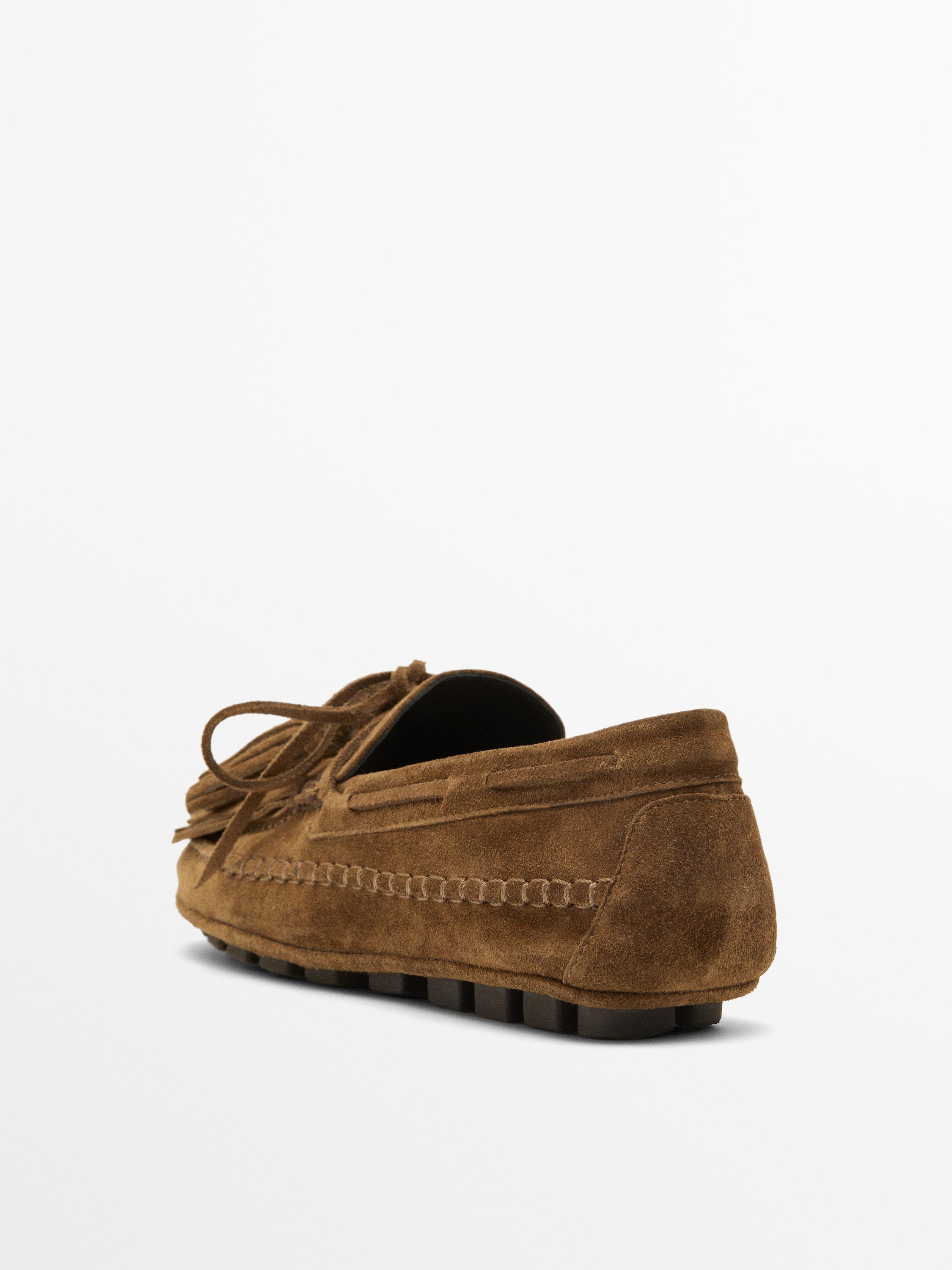 Mocassin à franges et pompons en croûte de cuir